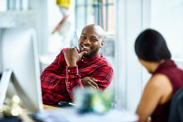 Man and woman talking in modern office Man and woman talking in modern office